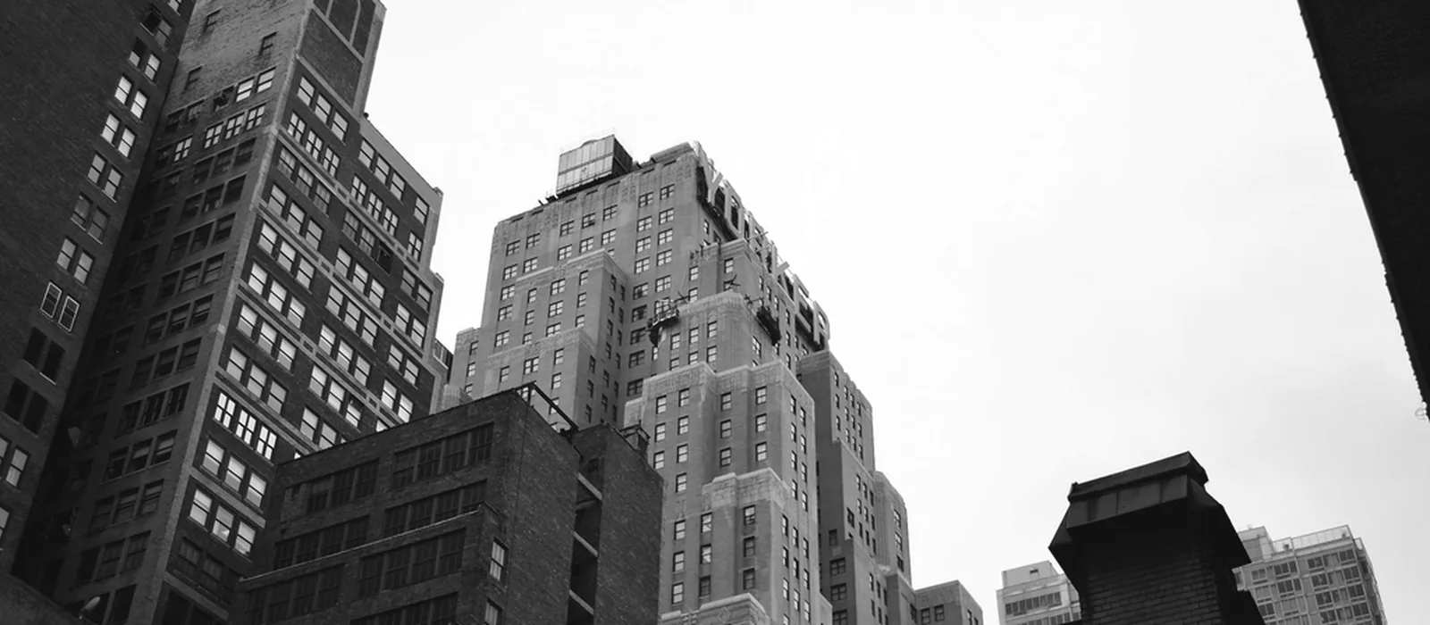 New York towers seen from the sidewalk.